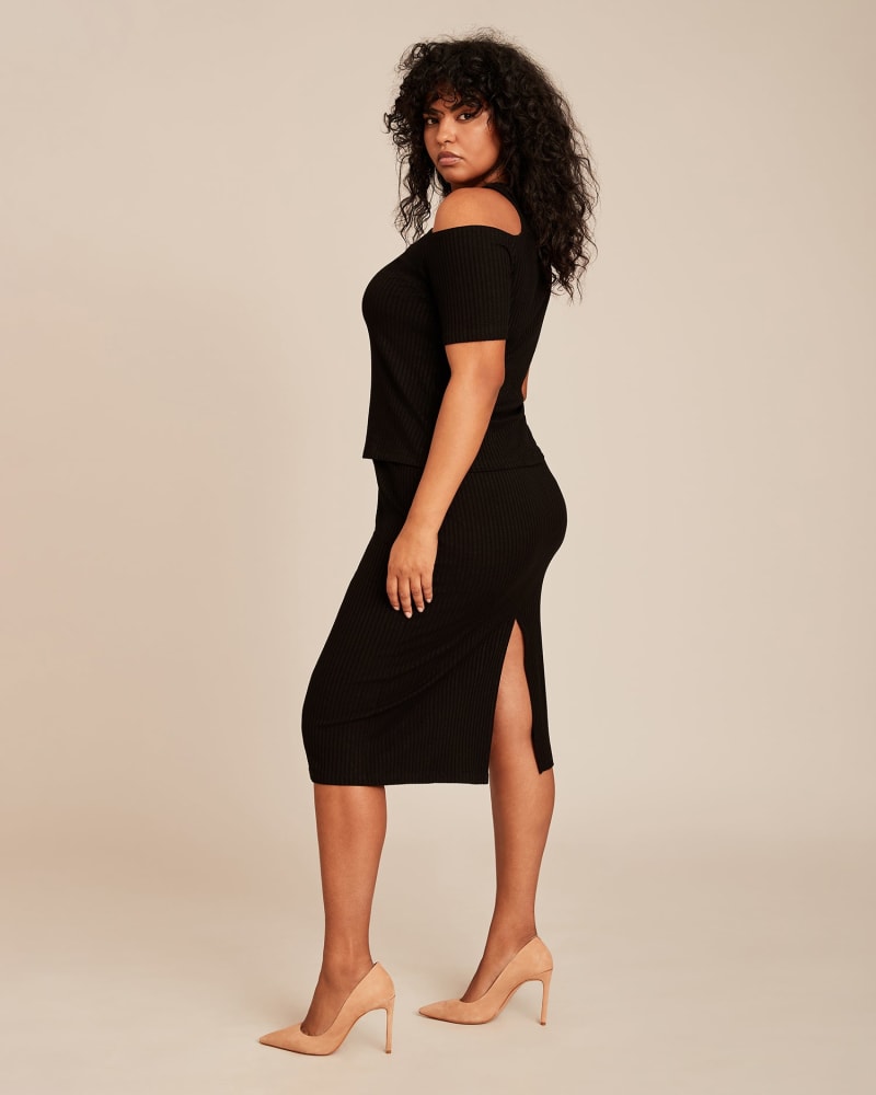 Side of a model wearing a size 2X Kessler Midi Skirt in Black by LNA. | dia_product_style_image_id:230788